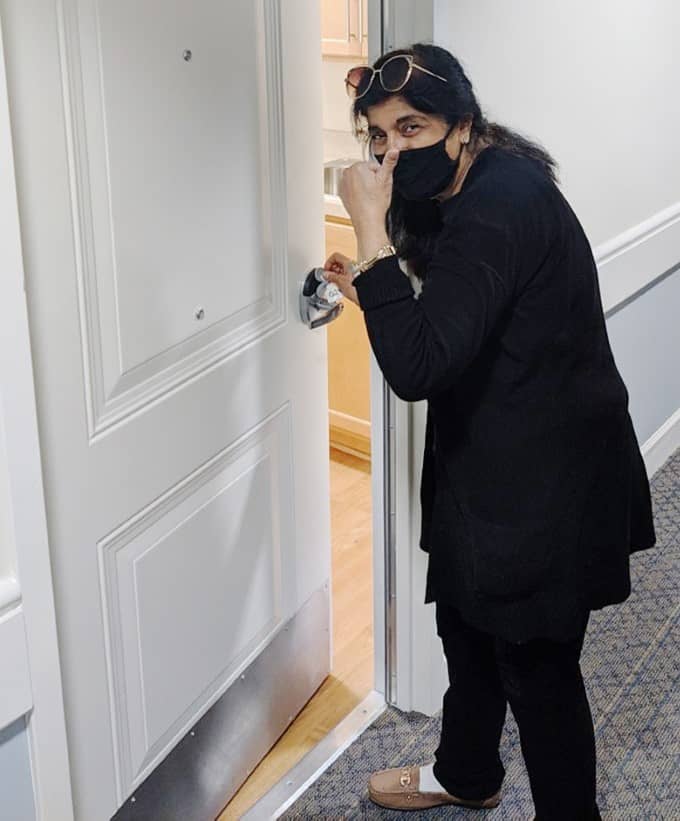 Ms. Farooqi at her apartment door.