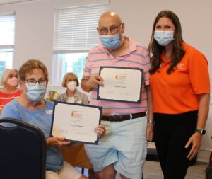 Nancy and George with their certificates.