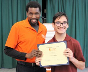Mihran Miller with his certificate and Donald Richardson.