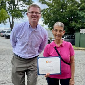 Shelley Brosnan with her certificate for Volunteer of the Year.